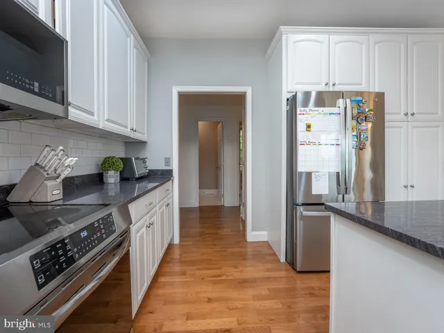 a view of an empty room with closet area