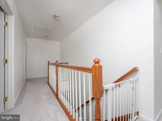 a view of a room with furniture and stairs