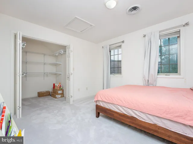 an aerial view of ocean and residential houses with outdoor space