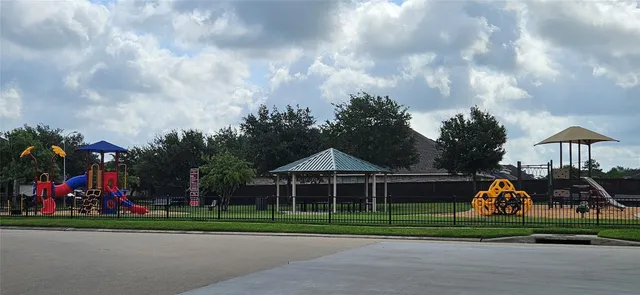 a front view of a house with a yard and table and chairs