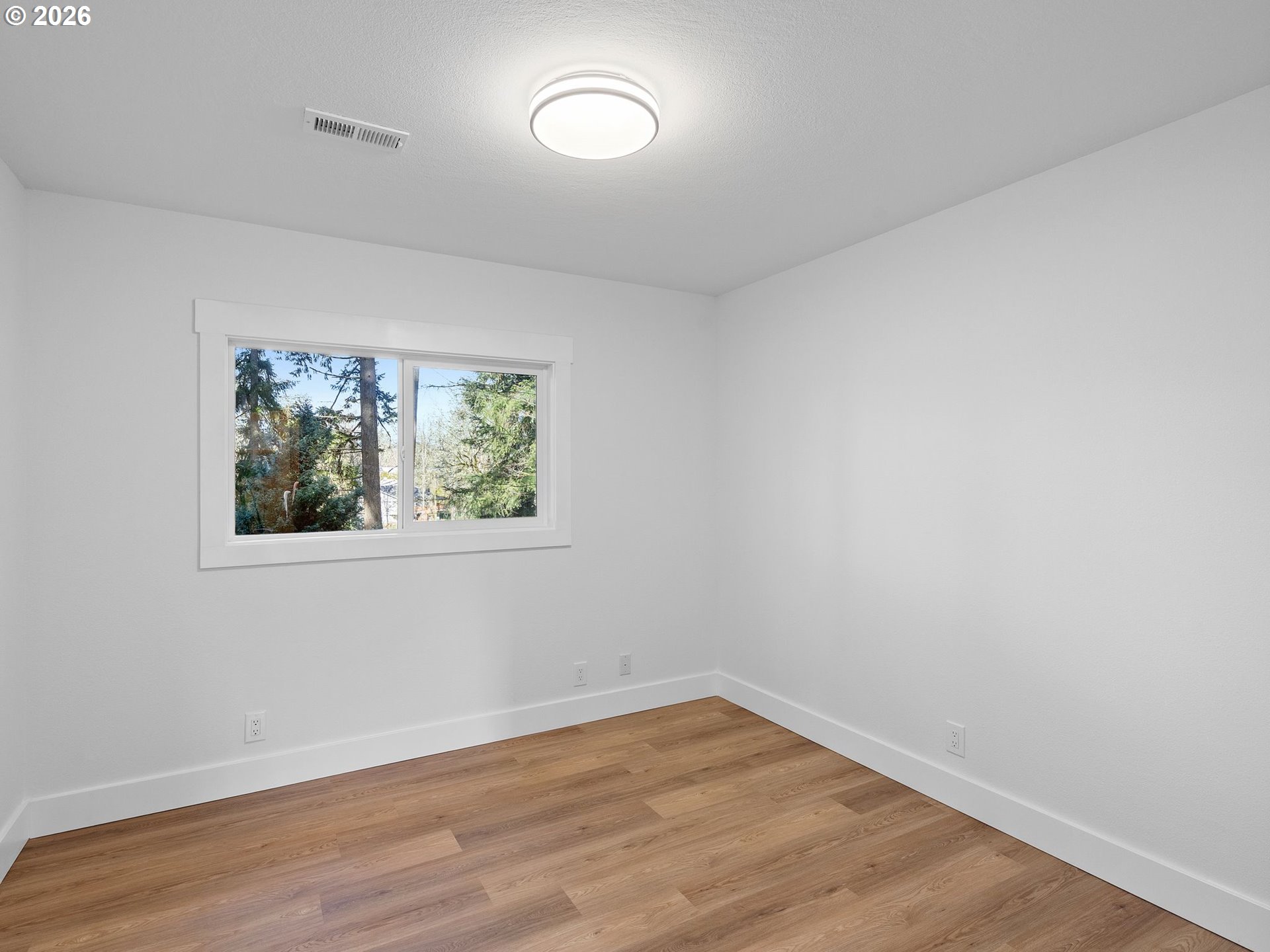 20270 Southwest Jaylee Street Beaverton, OR 97078 - Photo 19 of 40 wooden floor in an empty room with a window