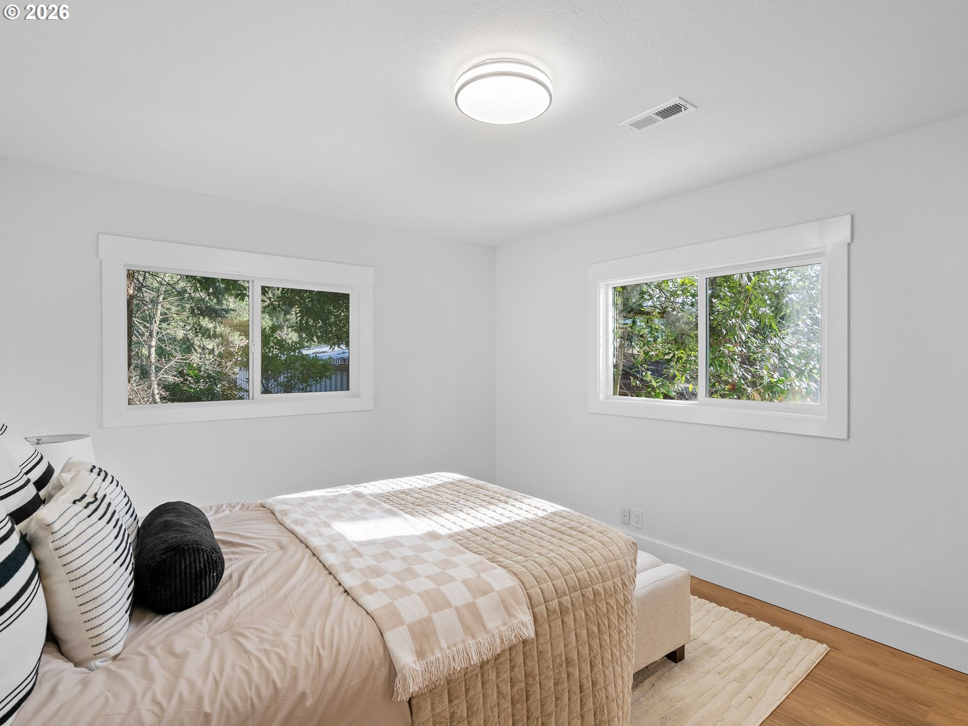 20270 Southwest Jaylee Street Beaverton, OR 97078 - Photo 21 of 40 a bedroom with a bed and a window