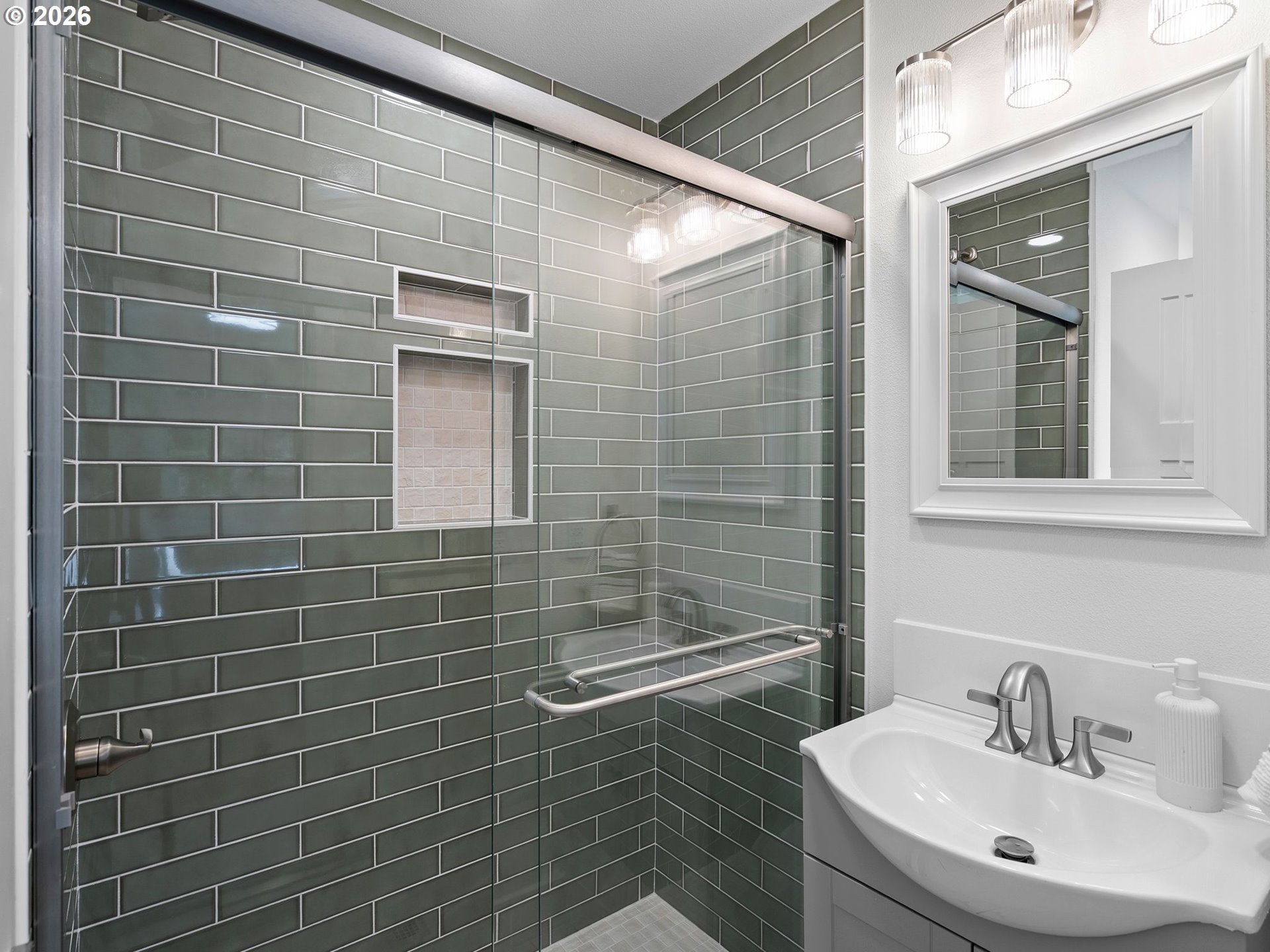 20270 Southwest Jaylee Street Beaverton, OR 97078 - Photo 23 of 40 a bathroom with a sink a shower and a mirror