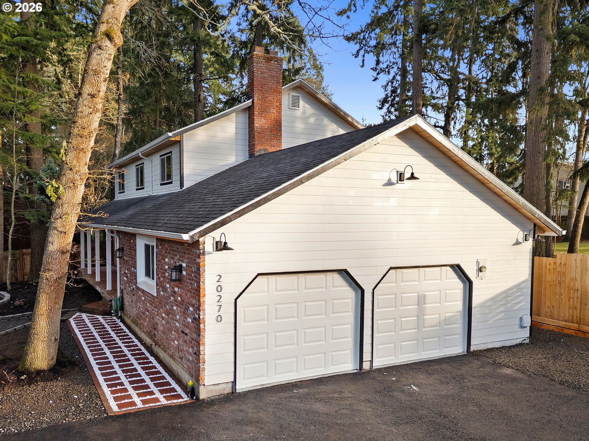 20270 Southwest Jaylee Street Beaverton, OR 97078 - Photo 3 of 40 a view of a house with a door and a tree