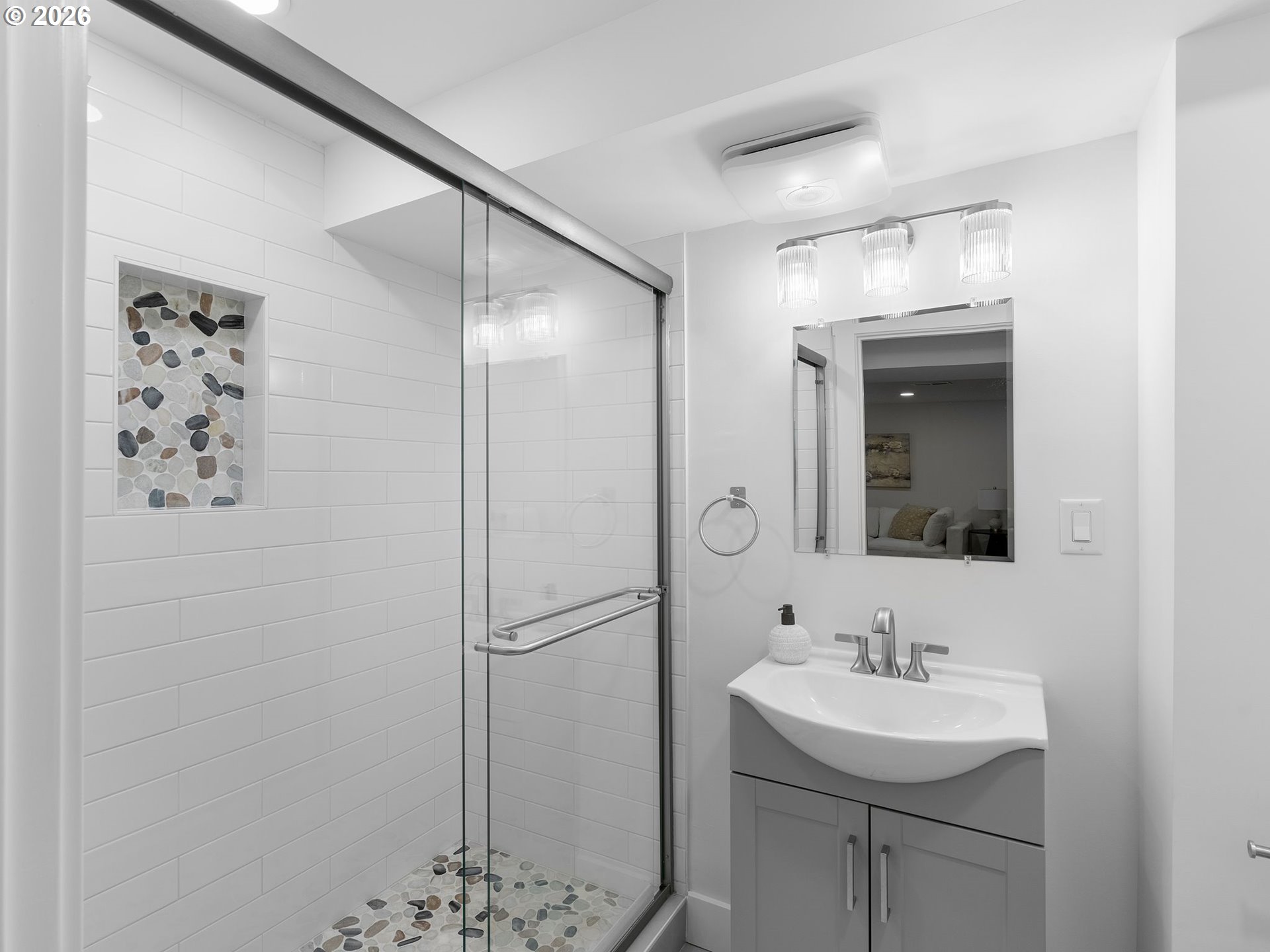 20270 Southwest Jaylee Street Beaverton, OR 97078 - Photo 35 of 40 a bathroom with a sink a mirror and a shower