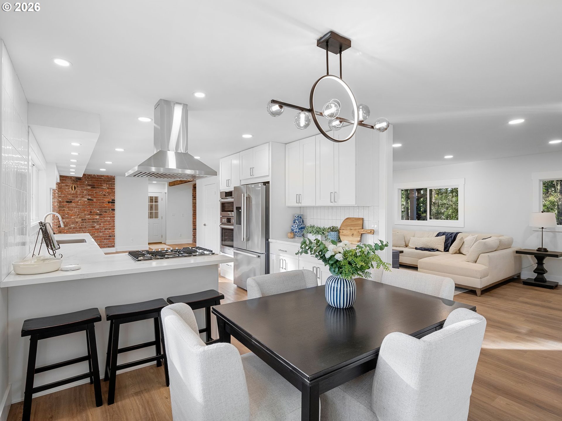 20270 Southwest Jaylee Street Beaverton, OR 97078 - Photo 9 of 40 a view of a dining room with furniture window and wooden floor