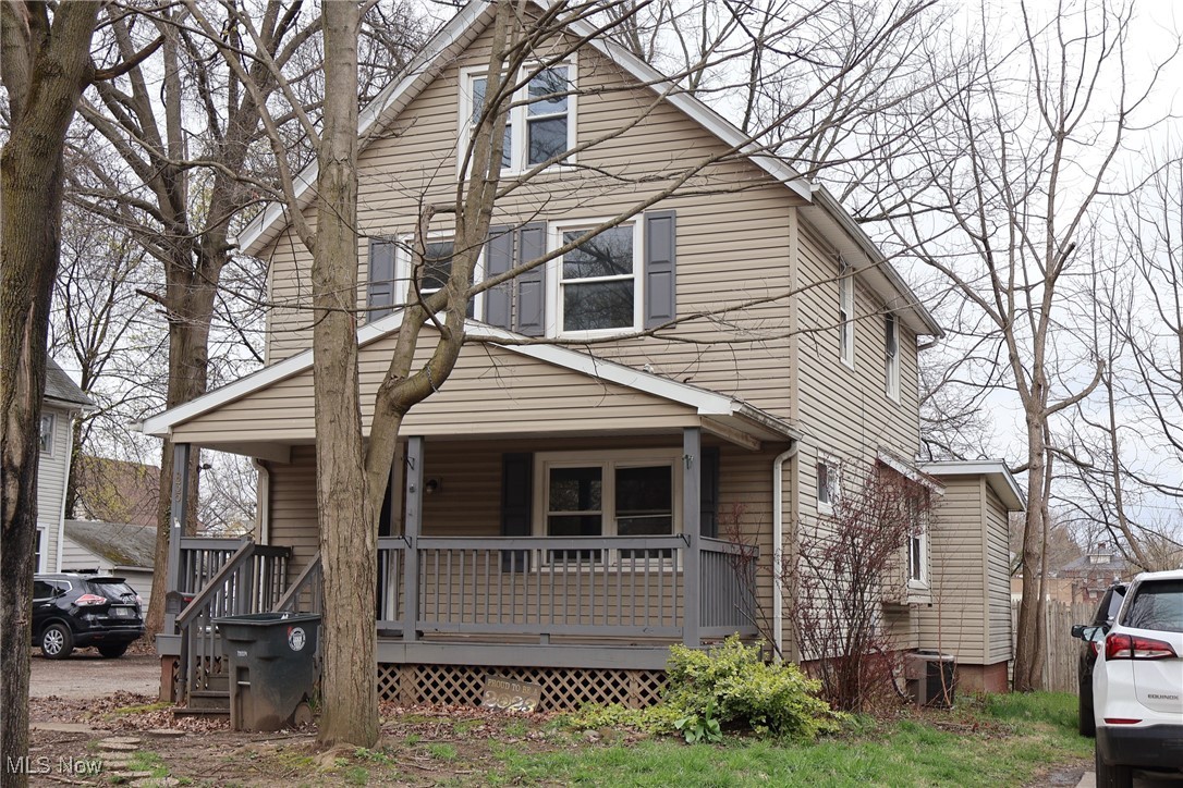 835 Berwin Street Akron, OH 44310 - Photo 3 of 18 View of front facade with cooling unit and covered porch