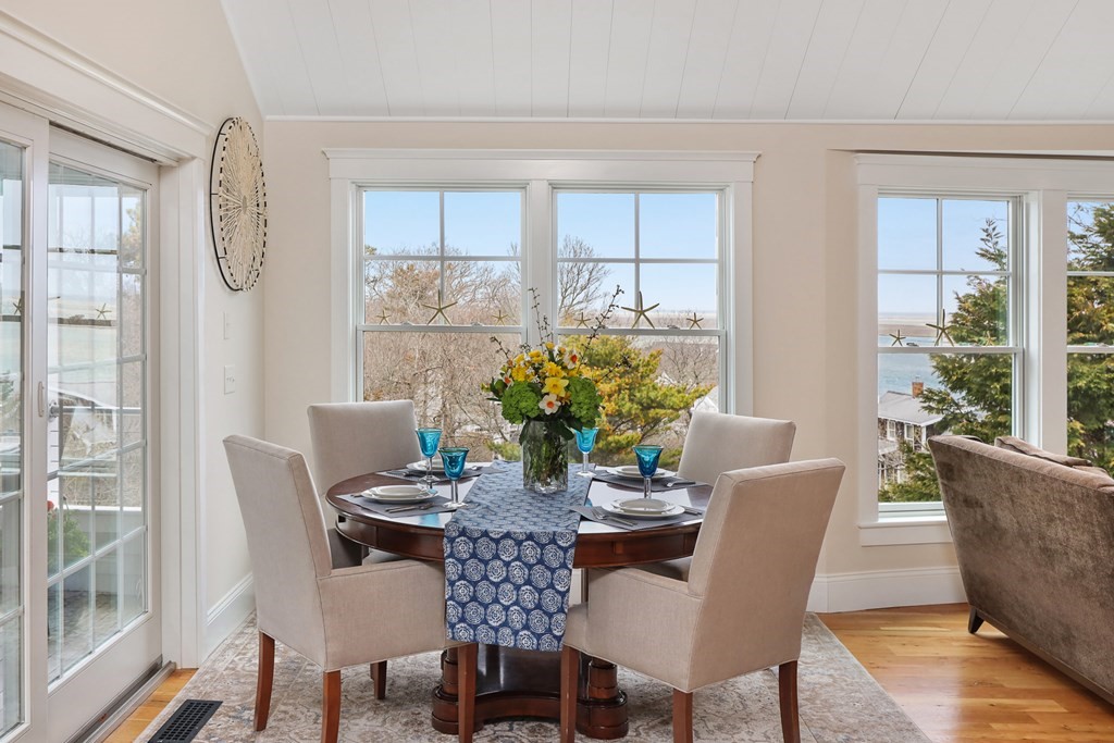 18 Snow Shore Road Orleans, MA 02653 - Photo 11 of 42 a view of a dining room with furniture window and wooden floor
