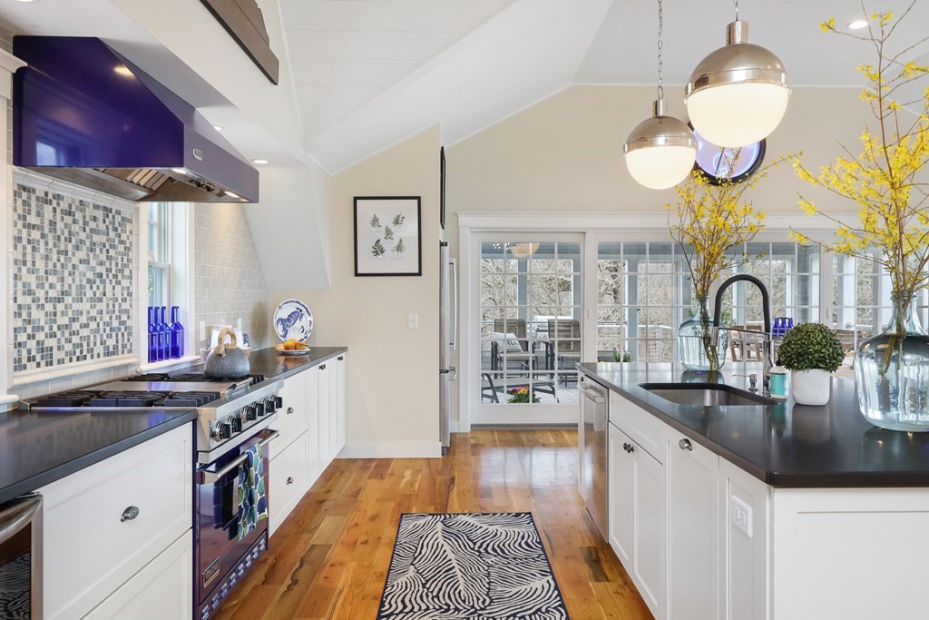 18 Snow Shore Road Orleans, MA 02653 - Photo 16 of 42 a kitchen with stainless steel appliances granite countertop a sink and cabinets