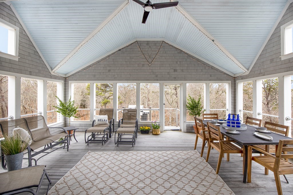 18 Snow Shore Road Orleans, MA 02653 - Photo 20 of 42 a living room with furniture and a large window