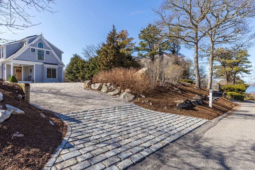 18 Snow Shore Road Orleans, MA 02653 - Photo 2 of 42 a front view of a house with a yard