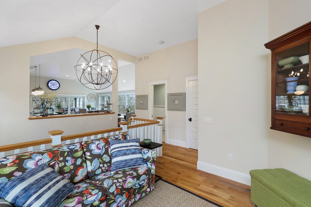 18 Snow Shore Road Orleans, MA 02653 - Photo 24 of 42 a living room with furniture and a chandelier