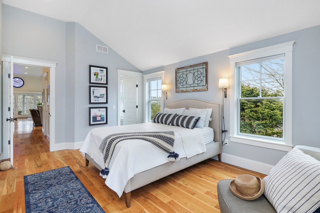 18 Snow Shore Road Orleans, MA 02653 - Photo 27 of 42 a bedroom with a bed and wooden floor