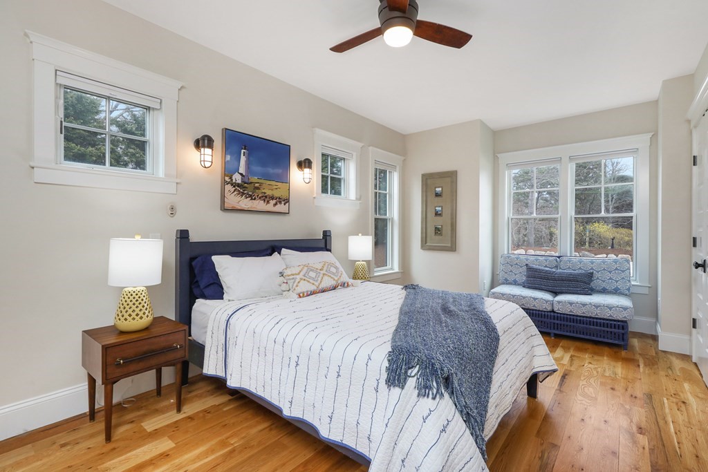 18 Snow Shore Road Orleans, MA 02653 - Photo 29 of 42 a spacious bedroom with a bed and a couch