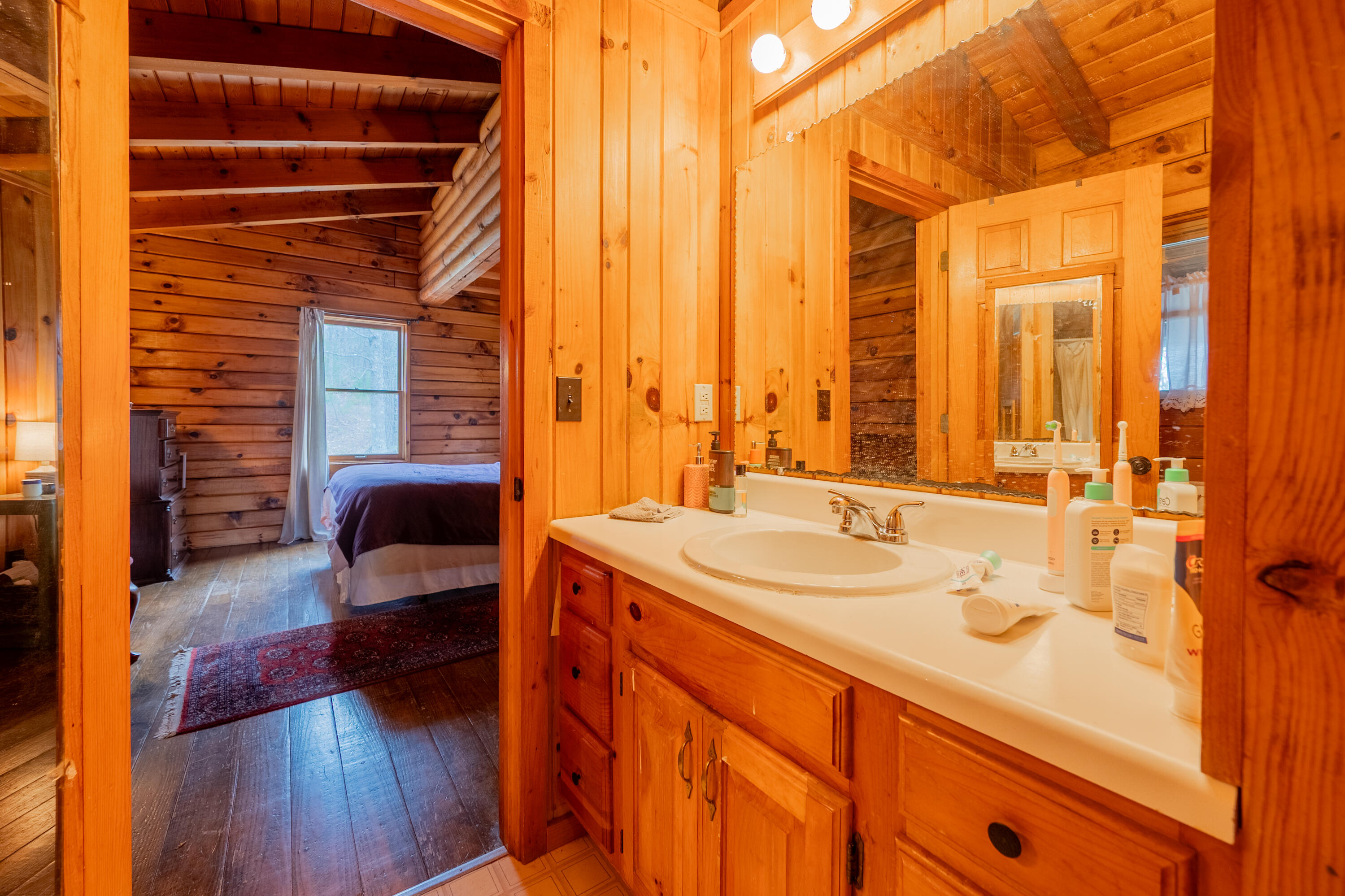 183 Pine Mountain Road Northeast Floyd, VA 24091 - Photo 21 of 54 a bathroom with a sink and a mirror