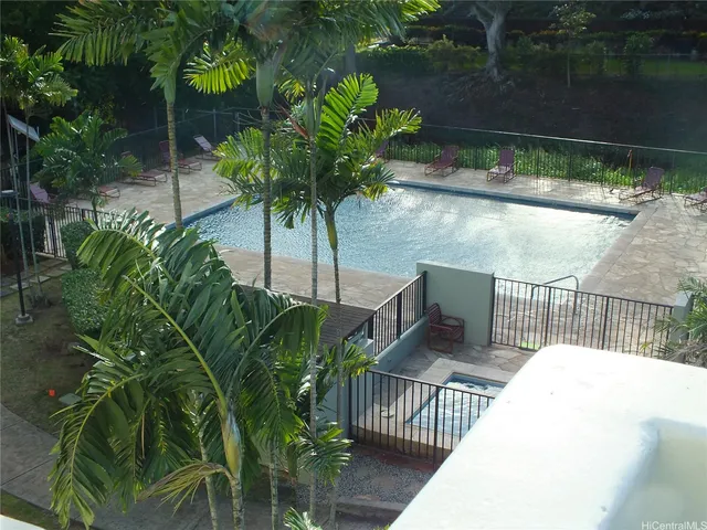 a view of balcony with wooden floor