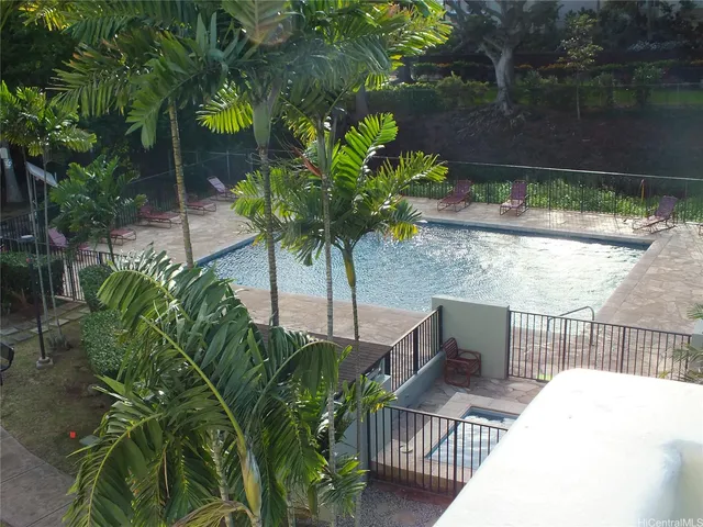 a view of balcony with wooden floor and outdoor seating