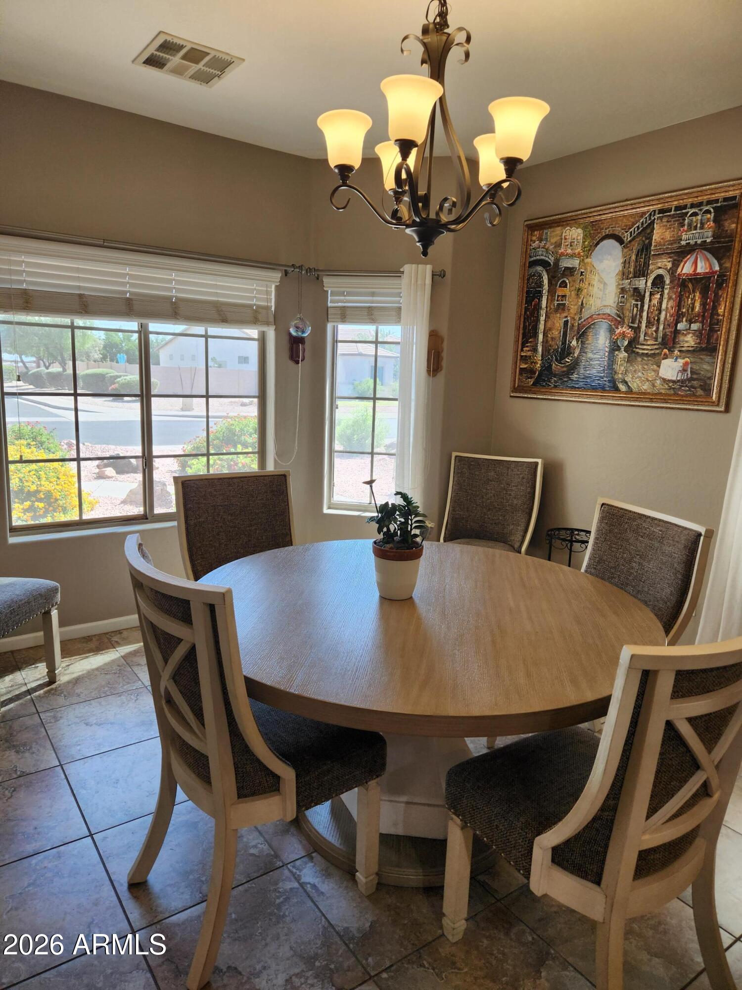 108 East Ridgeview Trail Casa Grande, AZ 85122 - Photo 1 of 38 a view of a dining room with furniture and chandelier