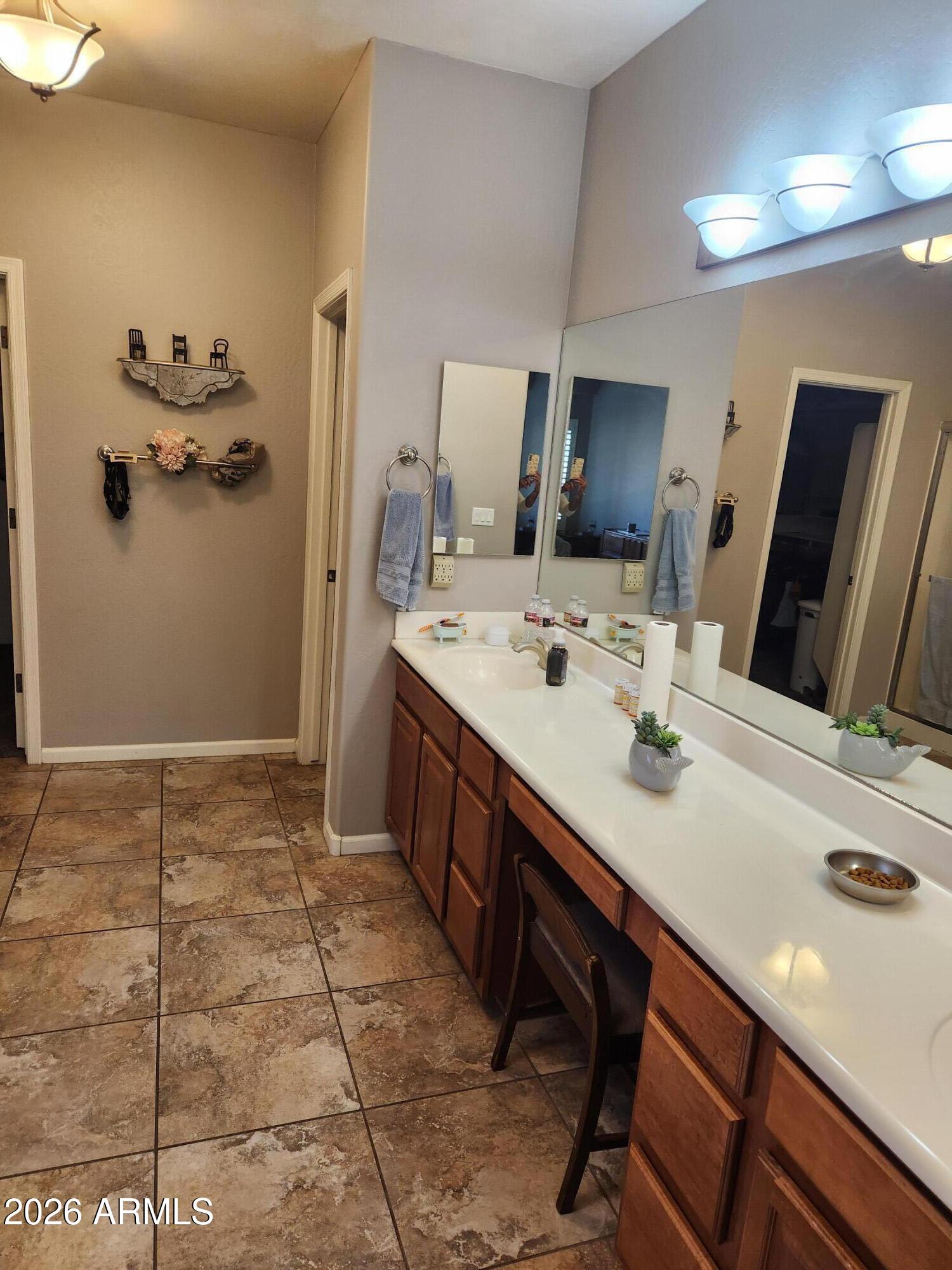 108 East Ridgeview Trail Casa Grande, AZ 85122 - Photo 15 of 38 a spacious bathroom with a granite countertop sink a mirror and shower