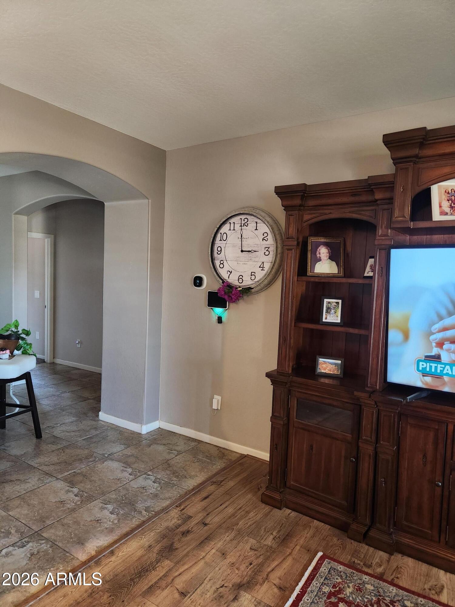 108 East Ridgeview Trail Casa Grande, AZ 85122 - Photo 18 of 38 a view of a hallway with wooden floor and furniture