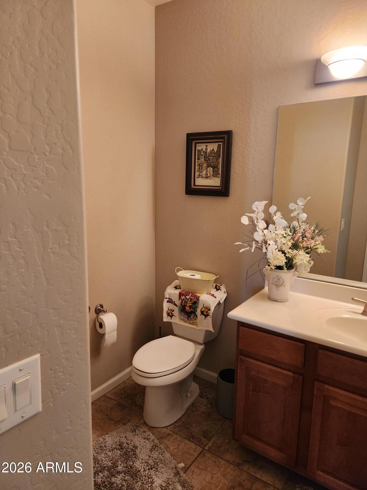 108 East Ridgeview Trail Casa Grande, AZ 85122 - Photo 22 of 38 a bathroom with a toilet sink and mirror