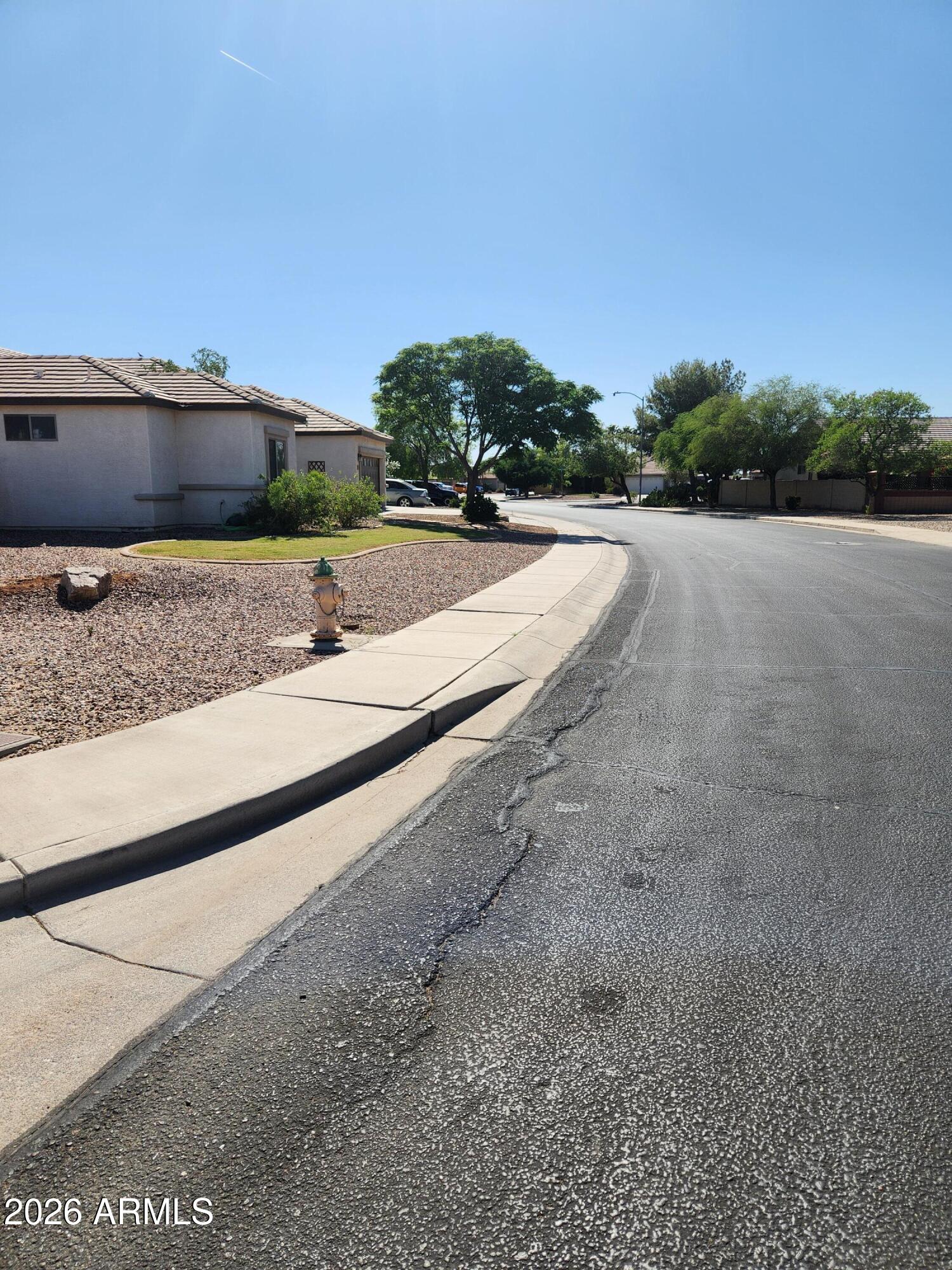 108 East Ridgeview Trail Casa Grande, AZ 85122 - Photo 31 of 38 a view of a road with a yard