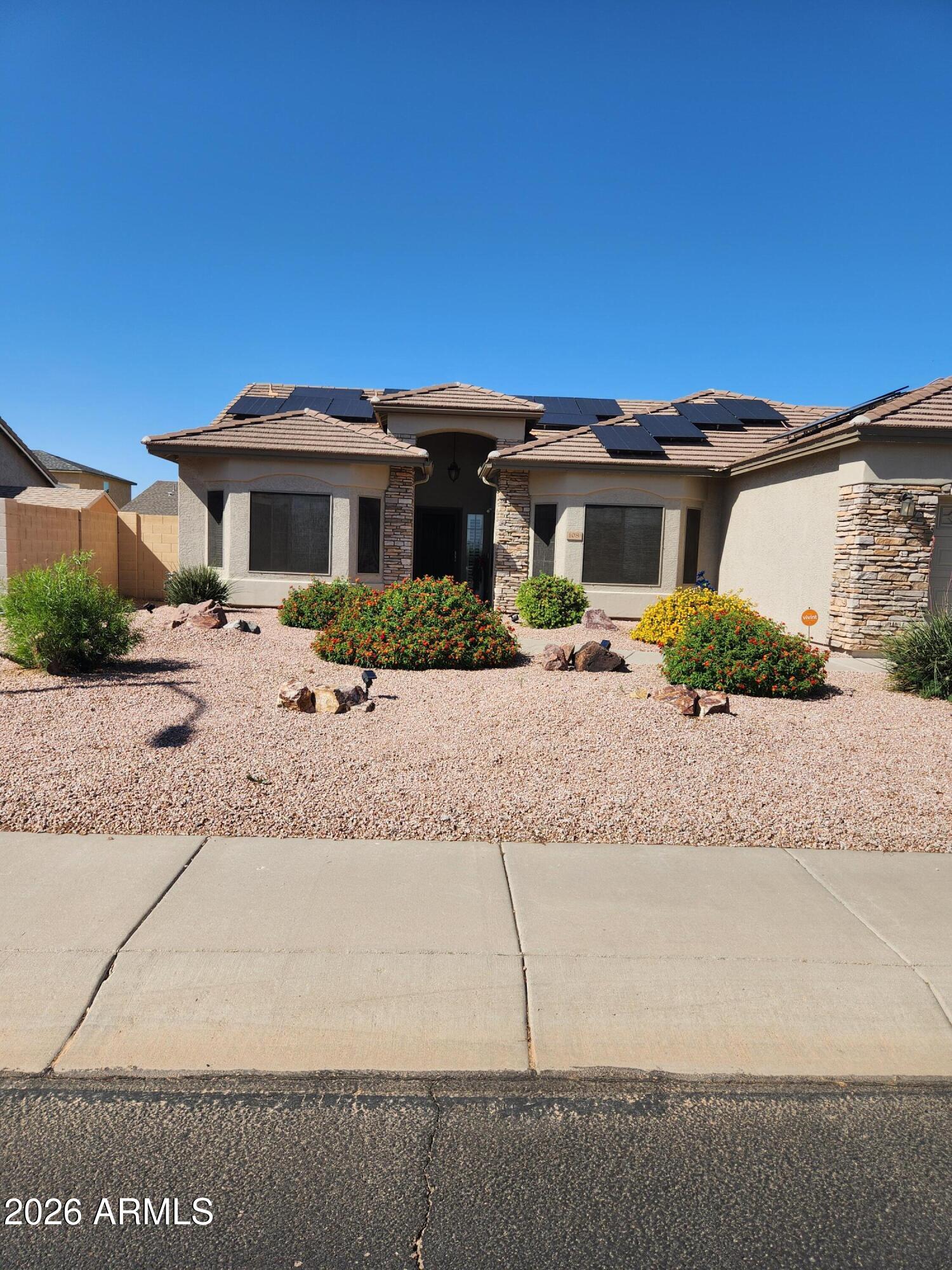 108 East Ridgeview Trail Casa Grande, AZ 85122 - Photo 34 of 38 a front view of a house with a yard