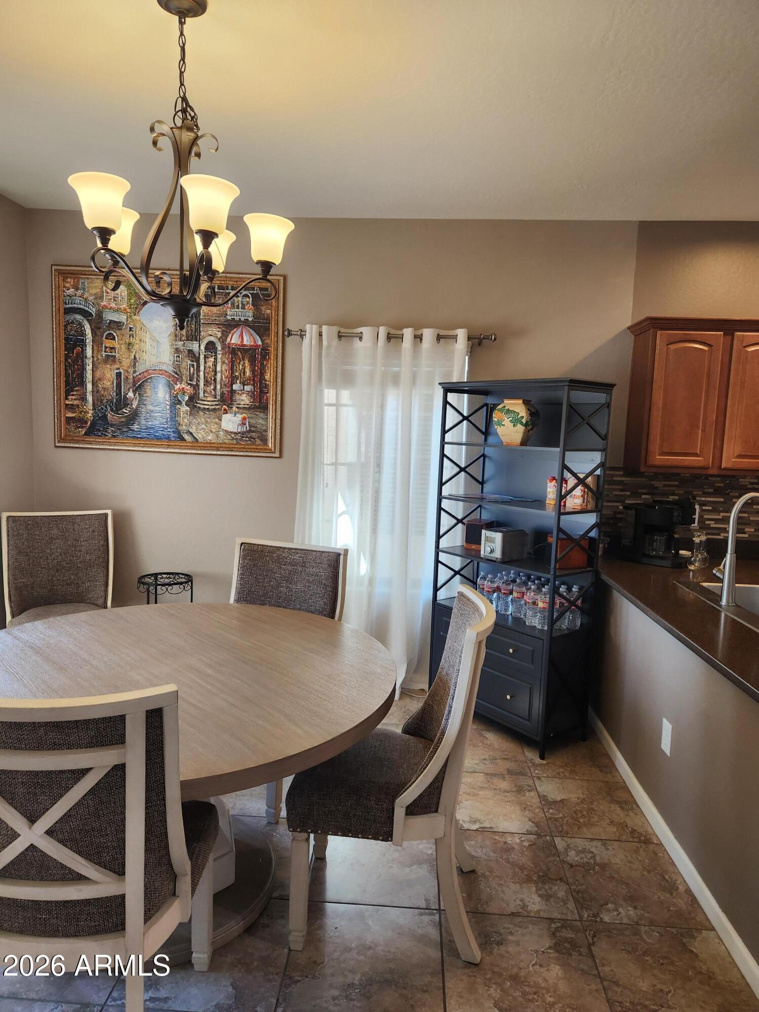 108 East Ridgeview Trail Casa Grande, AZ 85122 - Photo 4 of 38 a view of a dining room with furniture