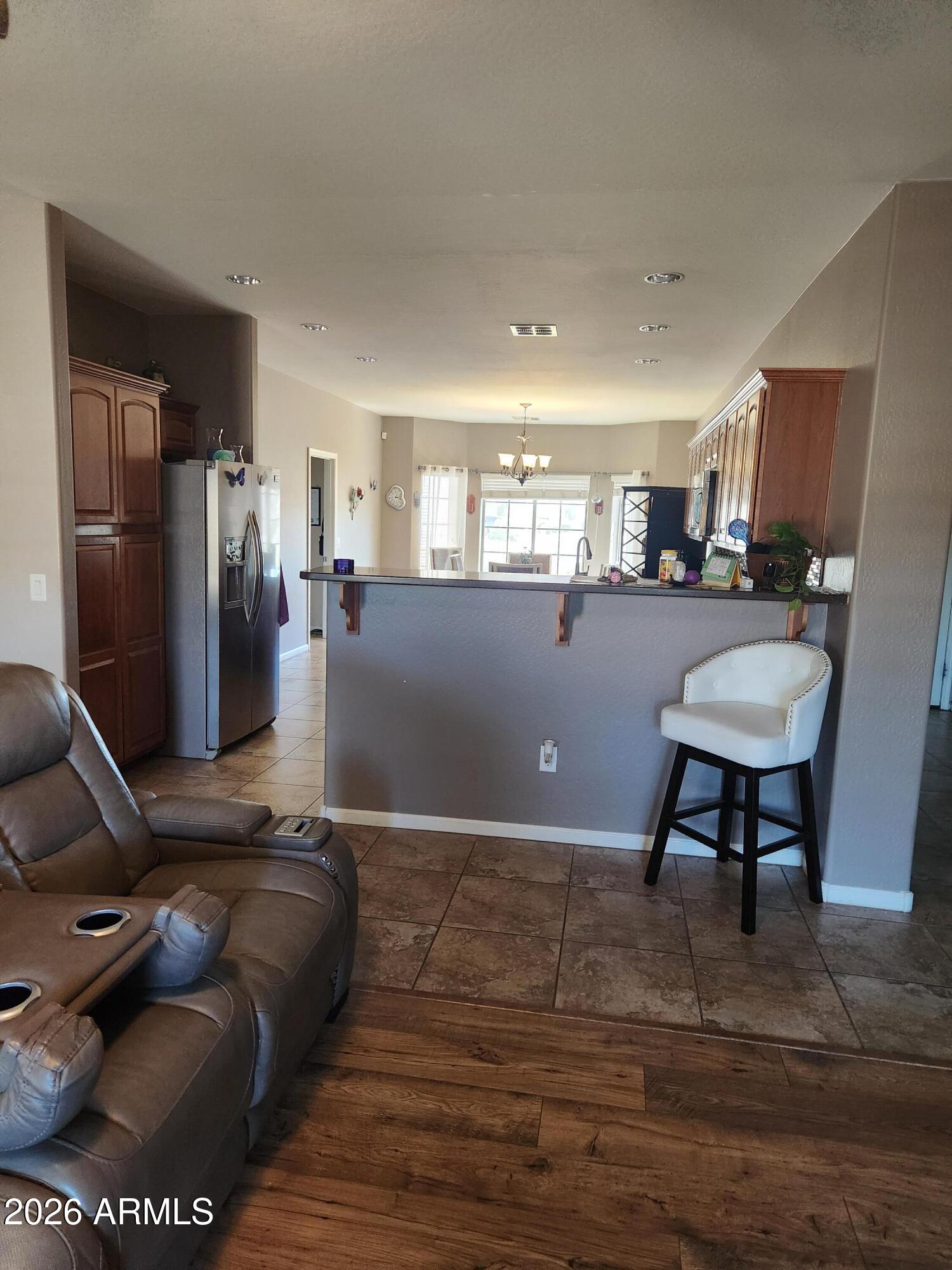 108 East Ridgeview Trail Casa Grande, AZ 85122 - Photo 7 of 38 a living room with a couch and a table