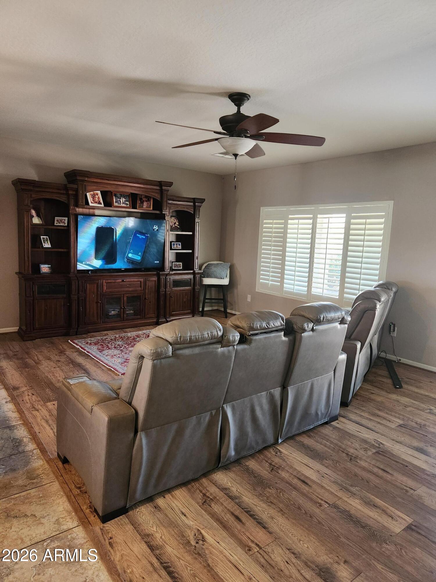 108 East Ridgeview Trail Casa Grande, AZ 85122 - Photo 9 of 38 a living room with furniture and a flat screen tv