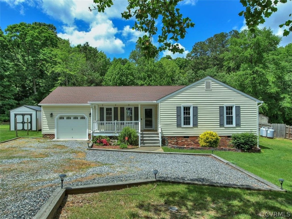 11130 Rufford Road Chester, VA 23831 - Photo 1 of 23 a front view of a house with a yard and trees