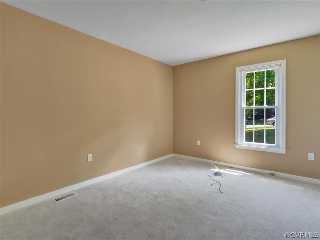 11130 Rufford Road Chester, VA 23831 - Photo 14 of 23 an empty room with a empty space and windows