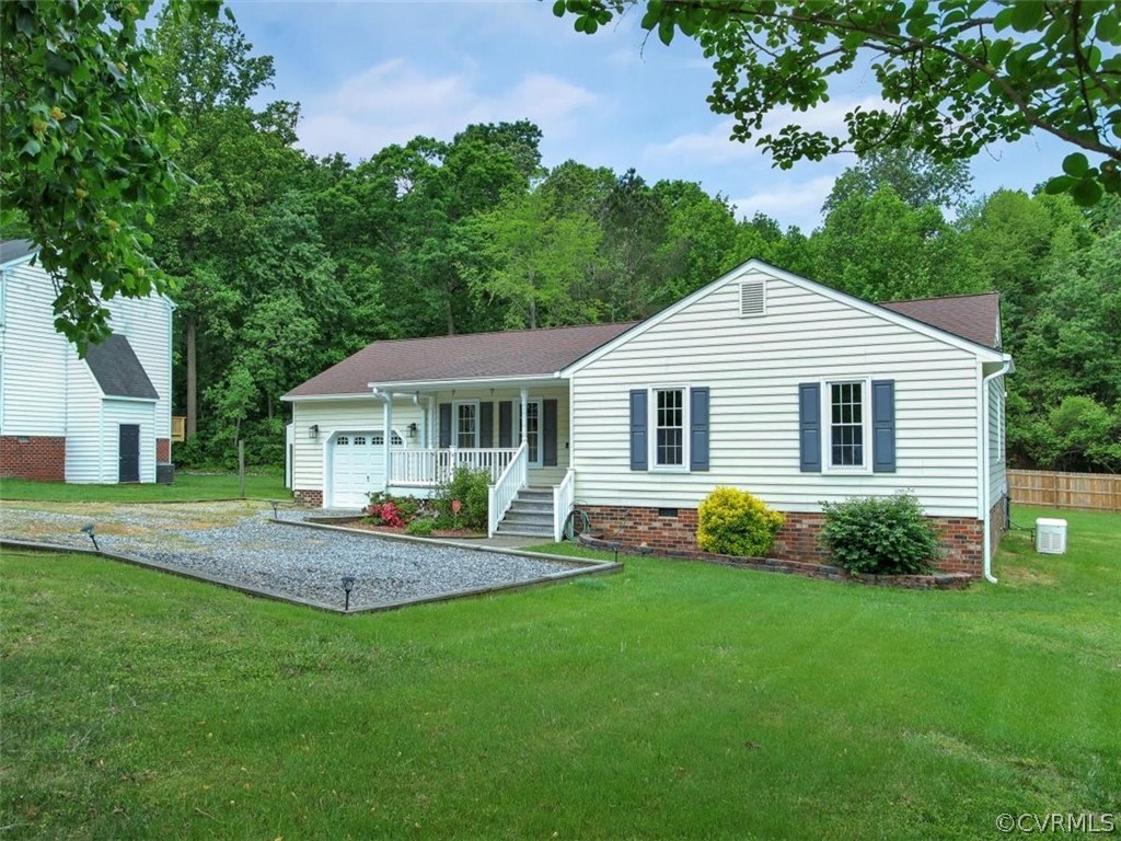 11130 Rufford Road Chester, VA 23831 - Photo 2 of 23 a front view of a house with a garden and yard