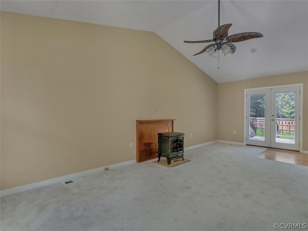 11130 Rufford Road Chester, VA 23831 - Photo 4 of 23 a view of a livingroom with a chair and a ceiling fan