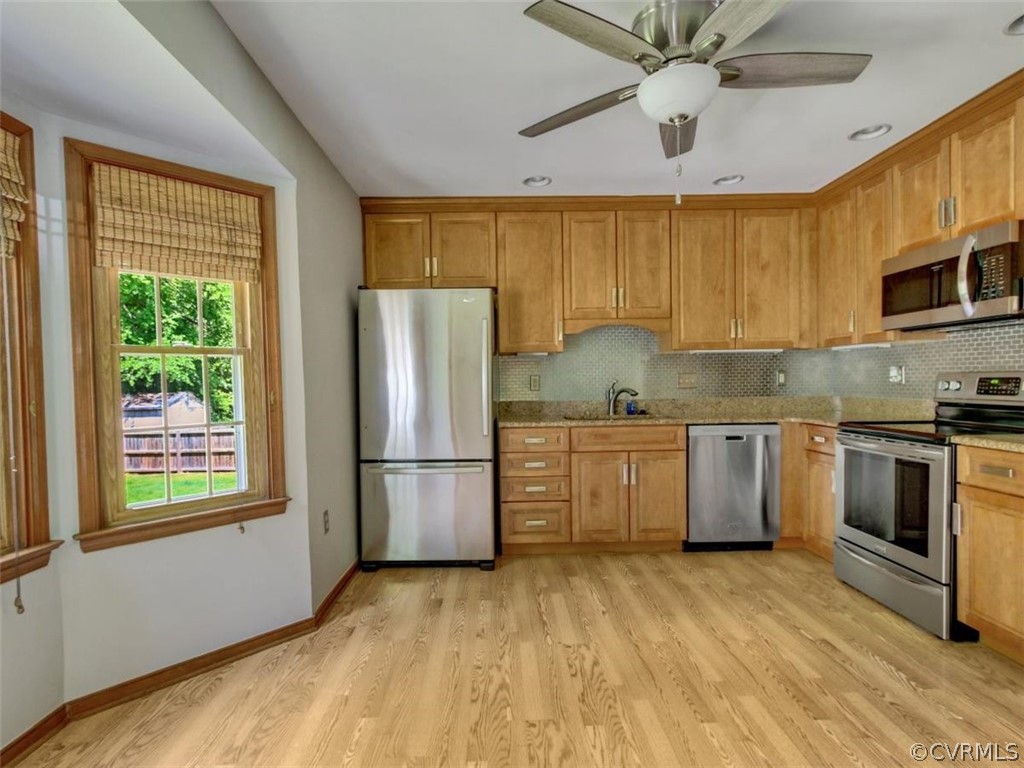 11130 Rufford Road Chester, VA 23831 - Photo 8 of 23 a kitchen with a sink cabinets stainless steel appliances and a window