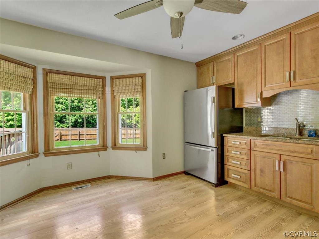 11130 Rufford Road Chester, VA 23831 - Photo 9 of 23 a kitchen with stainless steel appliances a refrigerator sink and cabinets