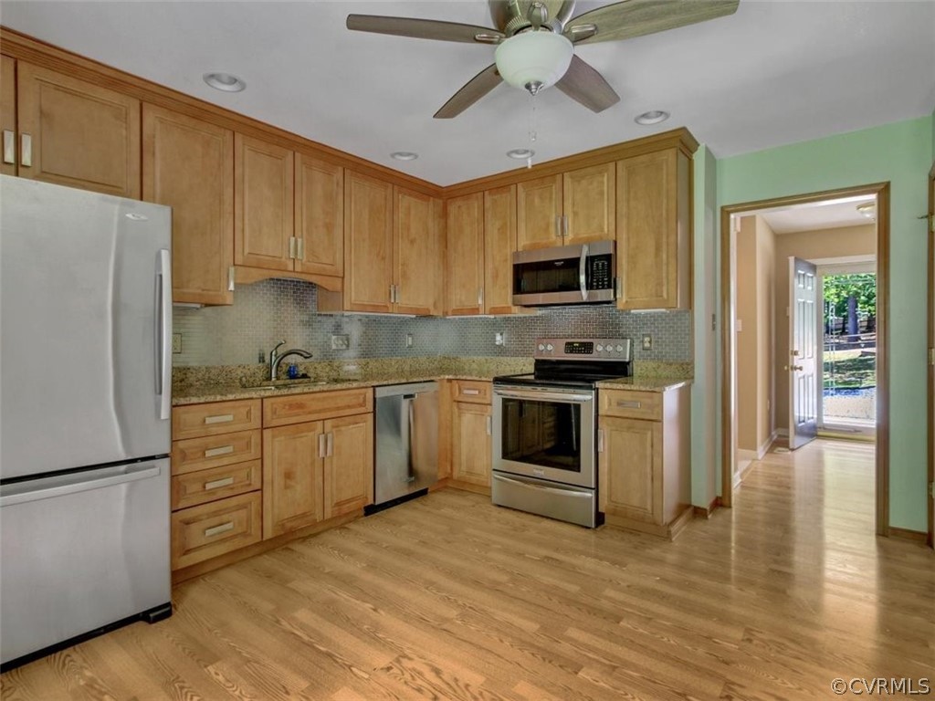 11130 Rufford Road Chester, VA 23831 - Photo 10 of 23 a kitchen with a refrigerator stove and microwave