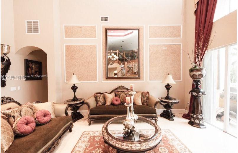 Miramar Miramar, FL 33029 - Photo 19 of 20 a living room with furniture and a fireplace