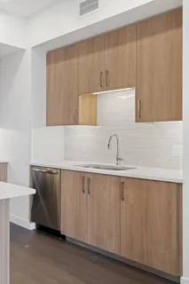 a close view of sink and cabinets