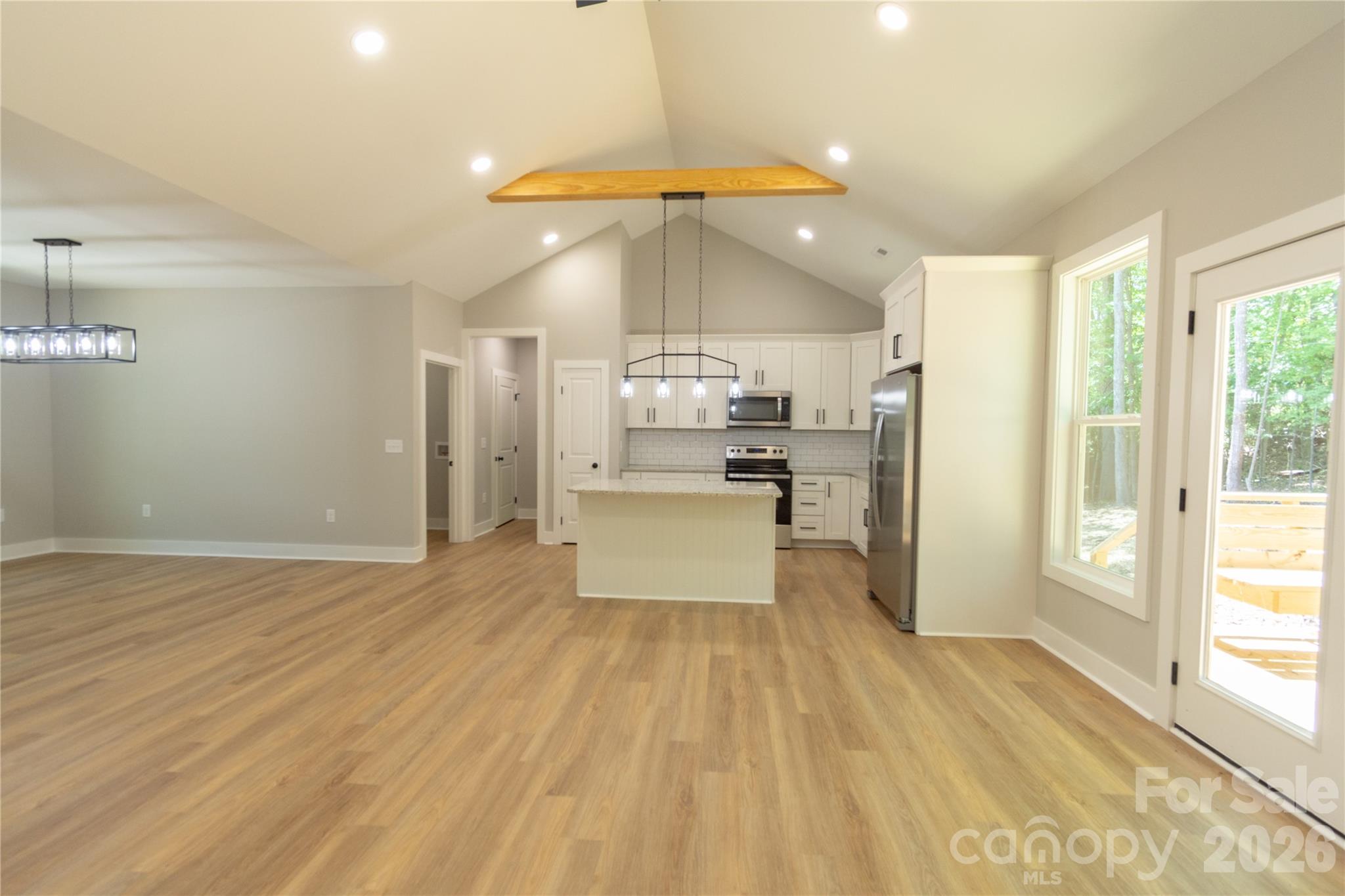 472 Oak Road Norwood, NC 28128 - Photo 11 of 27 a large kitchen with cabinets a sink and stainless steel appliances
