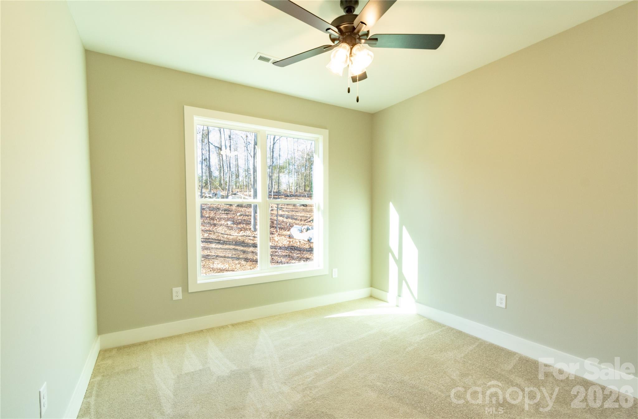 472 Oak Road Norwood, NC 28128 - Photo 16 of 27 a view of an empty room with a window