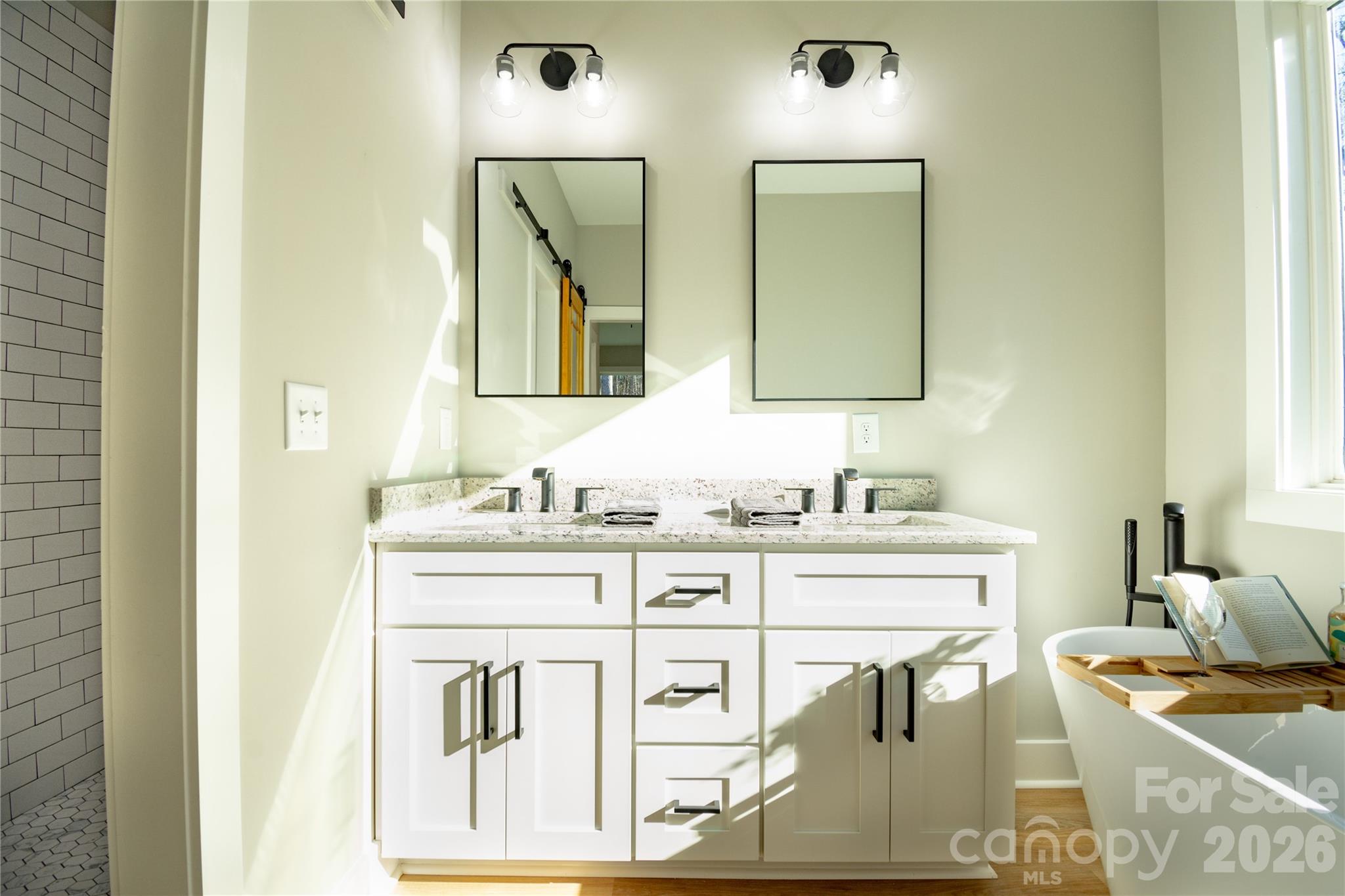 472 Oak Road Norwood, NC 28128 - Photo 20 of 27 a bathroom with a sink vanity and mirror