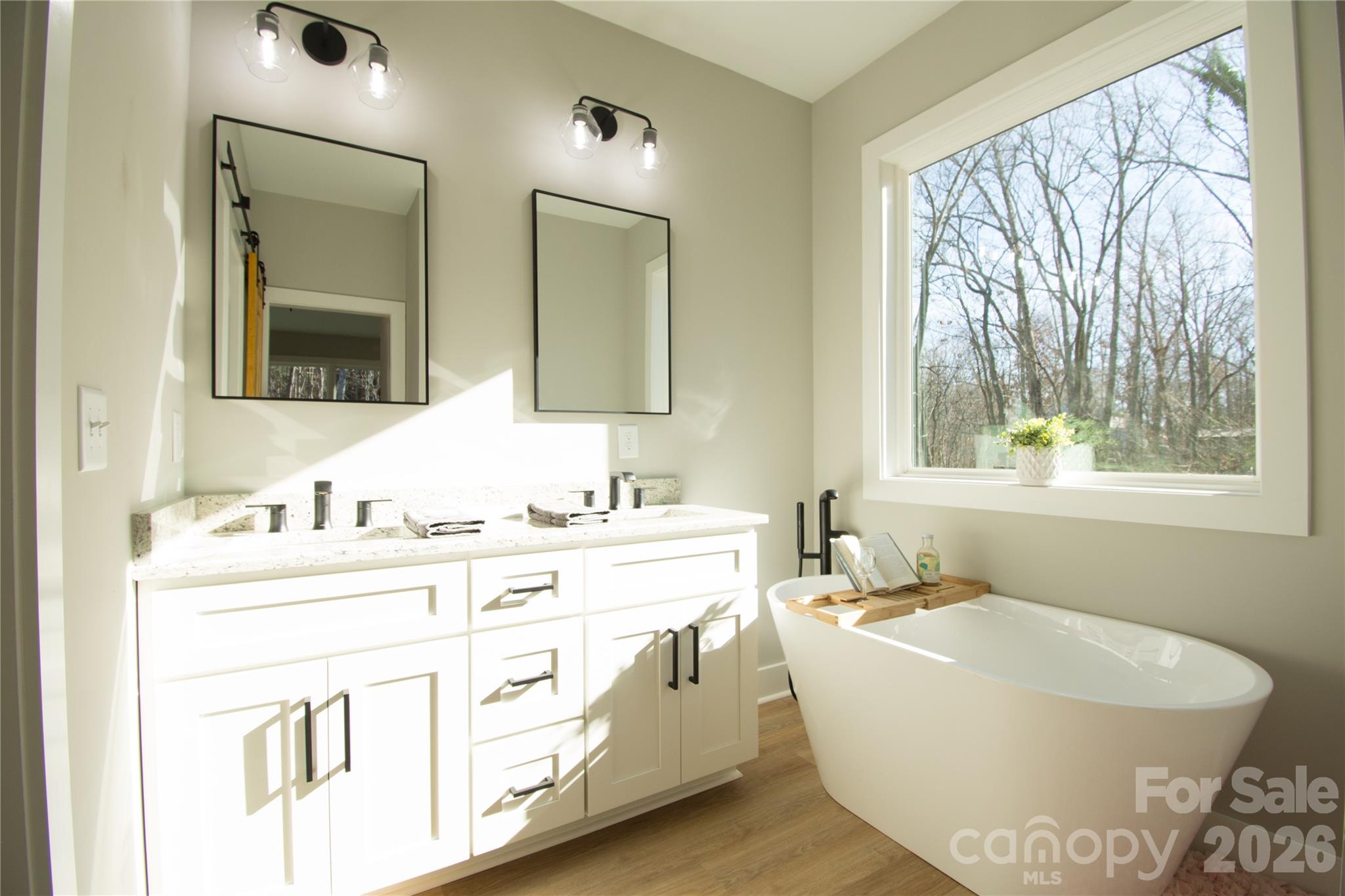 472 Oak Road Norwood, NC 28128 - Photo 21 of 27 a bathroom with a bathtub sink and mirror