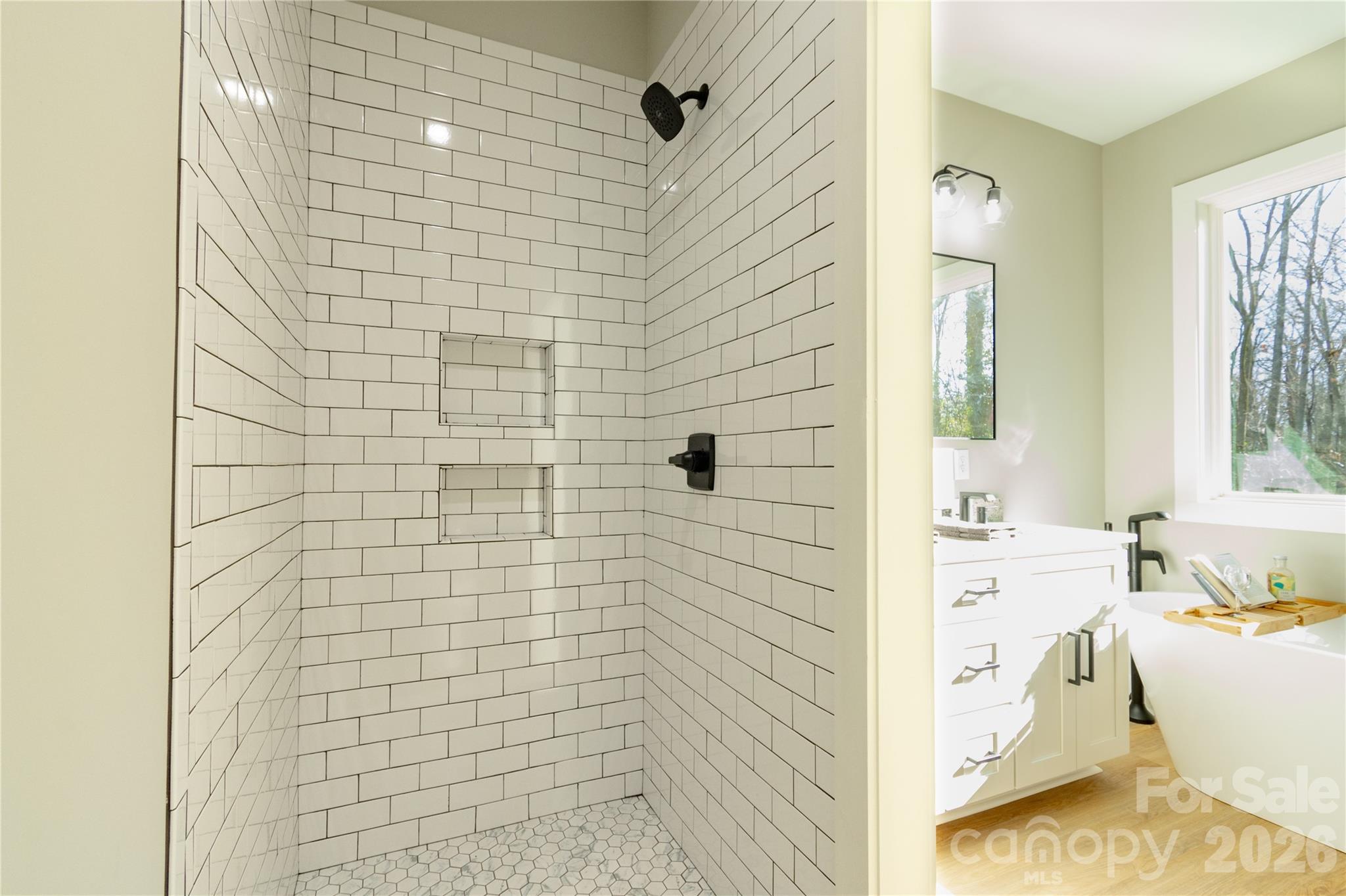 472 Oak Road Norwood, NC 28128 - Photo 22 of 27 a bathroom with a bathtub and shower