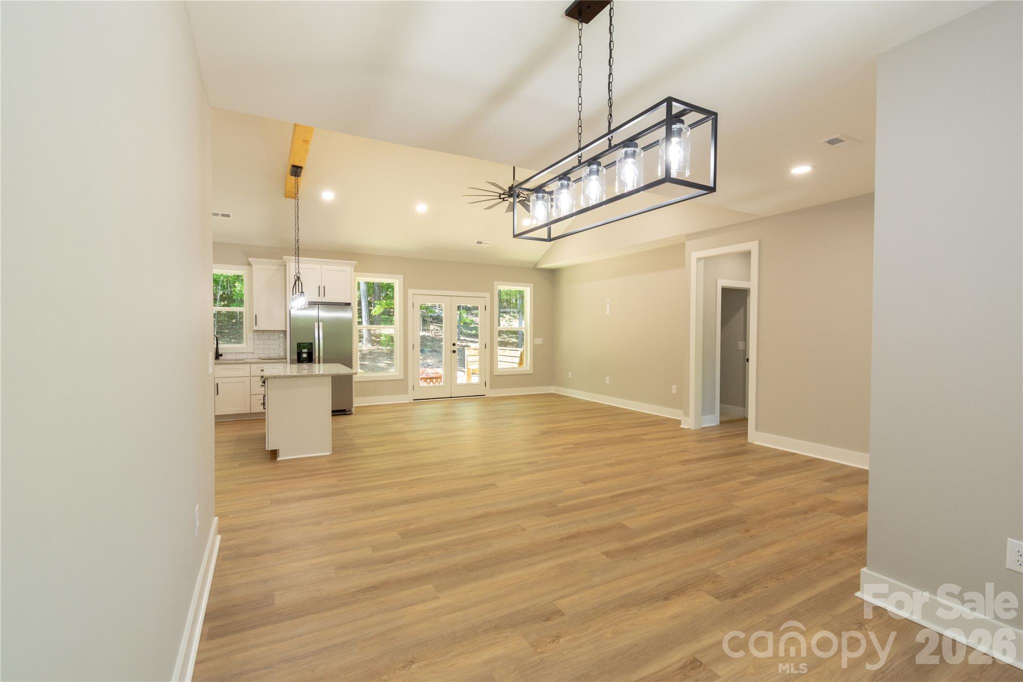 472 Oak Road Norwood, NC 28128 - Photo 5 of 27 a view of a kitchen with a sink and dishwasher a refrigerator with wooden floor