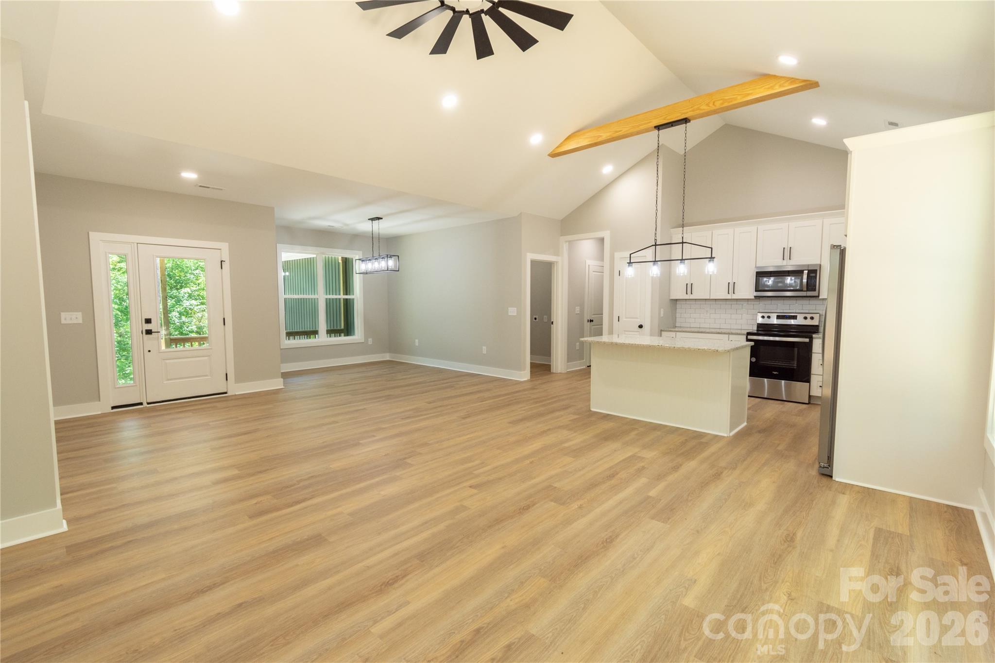472 Oak Road Norwood, NC 28128 - Photo 10 of 27 a view of a kitchen with wooden floor and electronic appliances