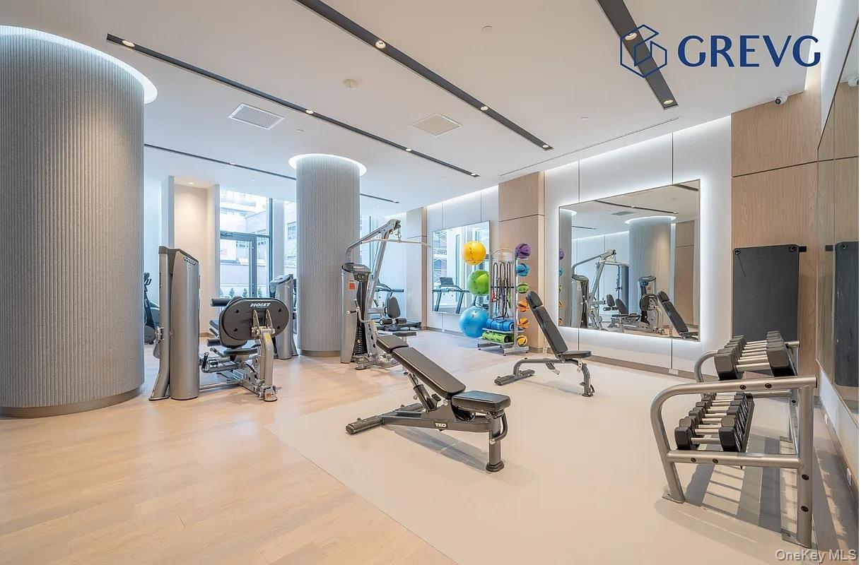 136-18 Maple Avenue, Unit 16A Queens, NY 11355 - Photo 5 of 15 a view of a room with gym equipment