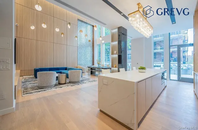 a bathroom with a tub a sink and a mirror