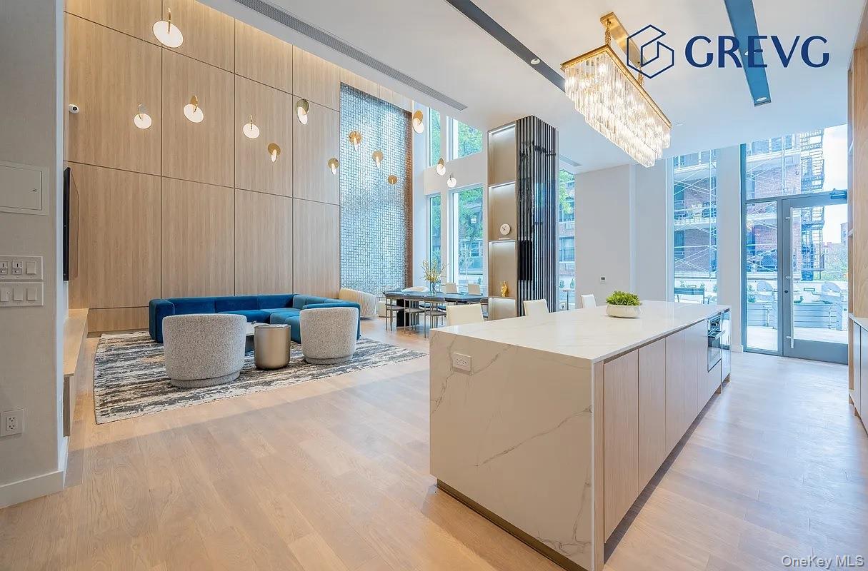 136-18 Maple Avenue, Unit 16A Queens, NY 11355 - Photo 6 of 15 a bathroom with a tub a sink and a mirror