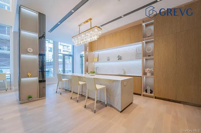 a utility room with cabinets dryer and washer